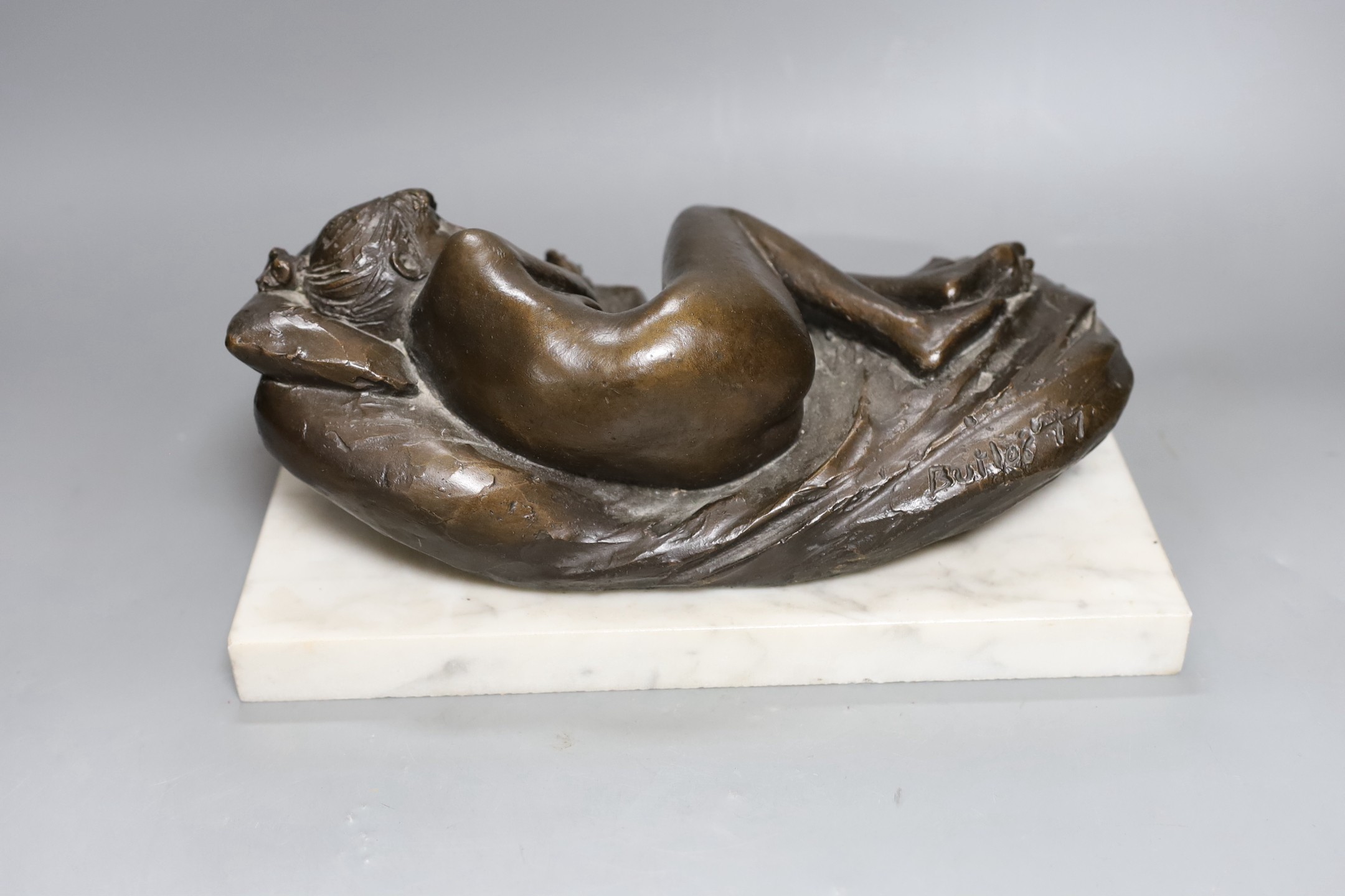 James Butler R.A. (1931-2022) A bronze reclining nude, 'Butler, 77'on a white marble plinth, total length 30.5 cm